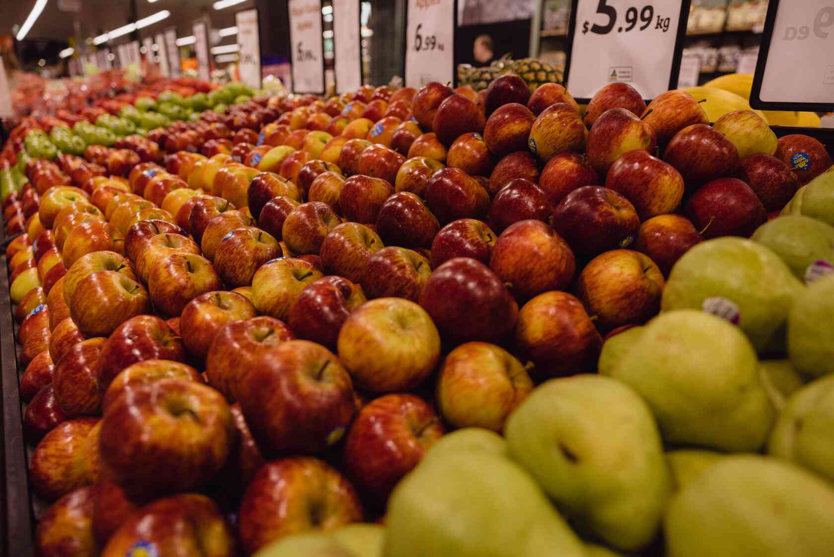 Display of a variety of apples including Red Delicious to Granny Smiths.