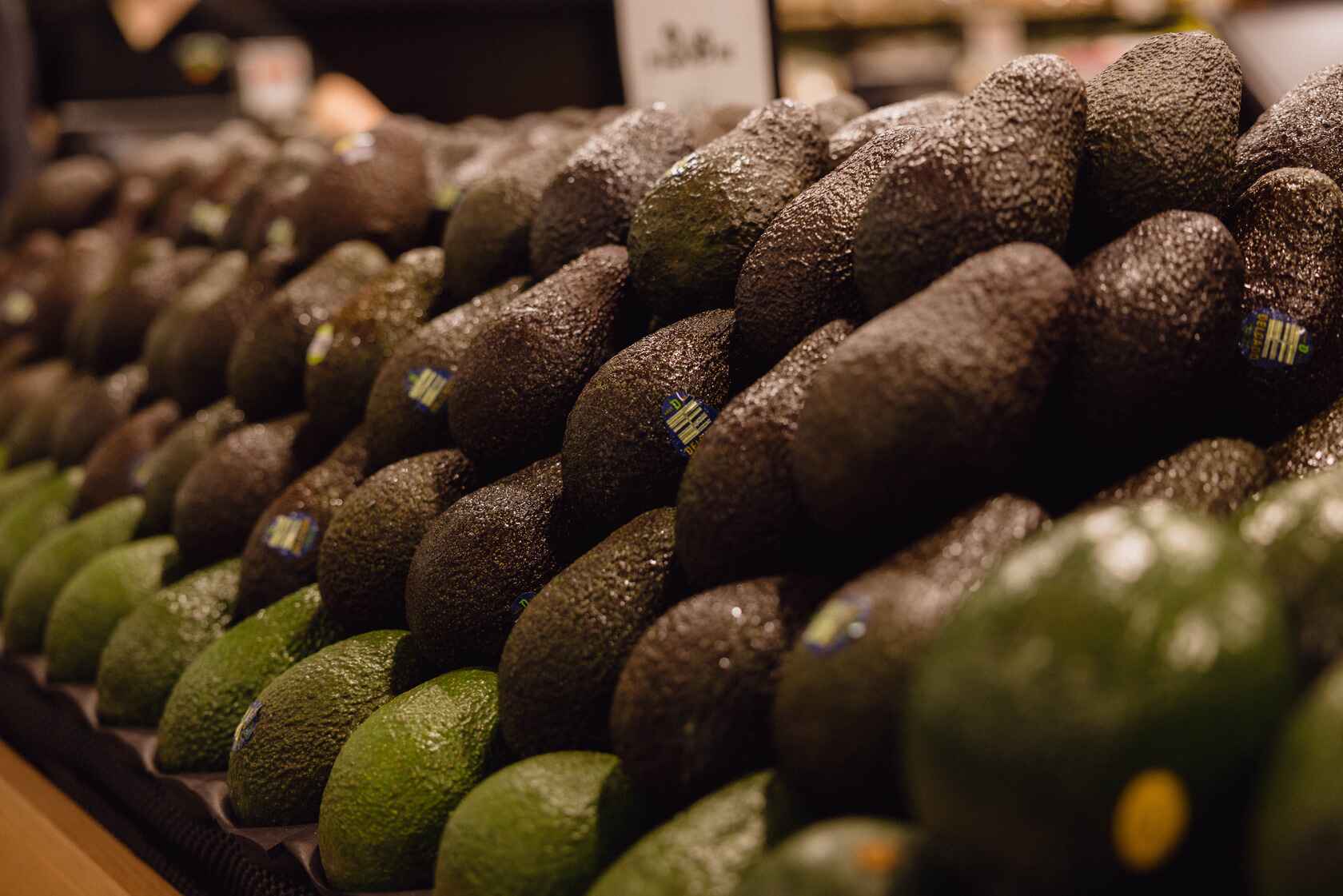 In-store photo: Ripe hass avocados layered standing up