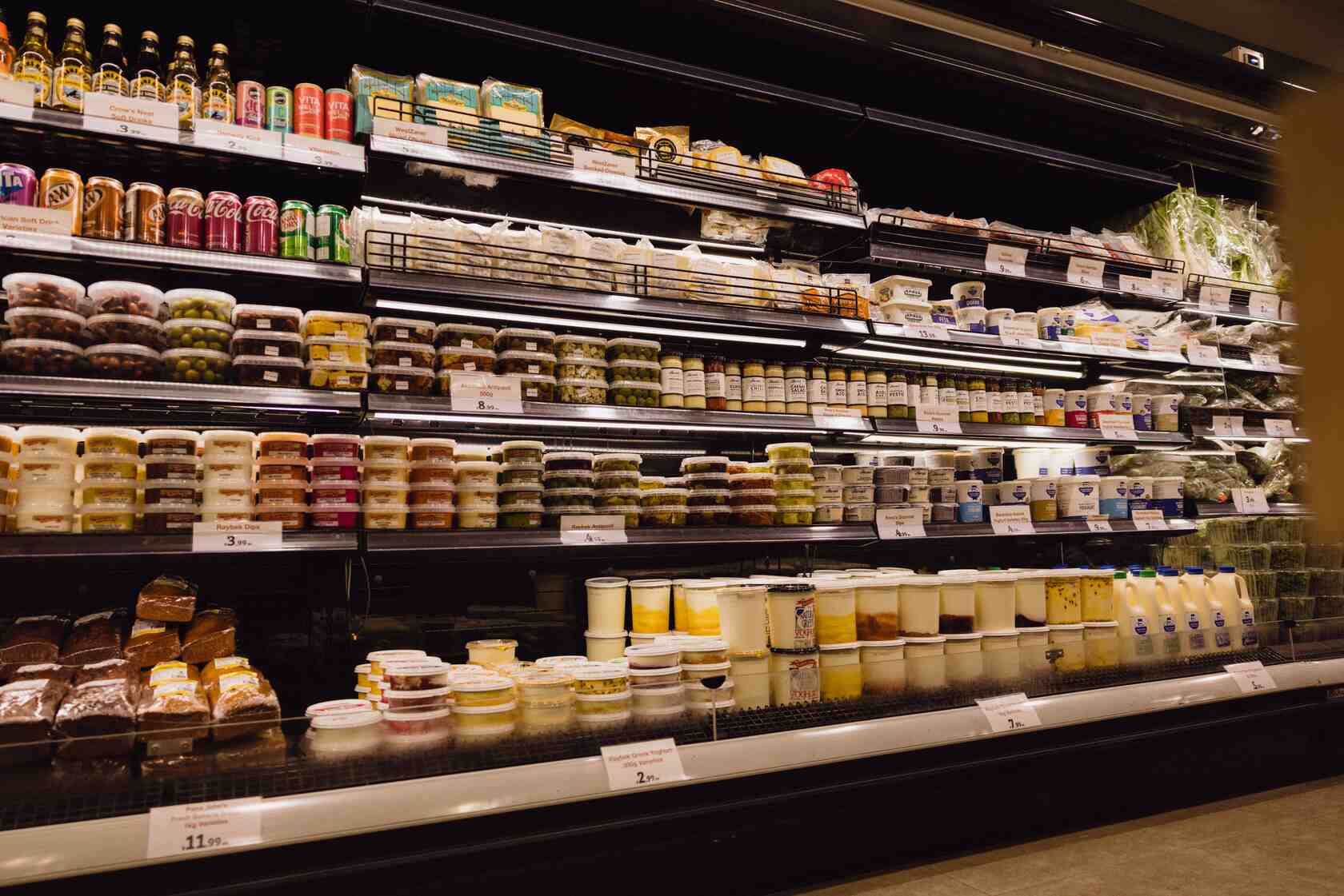 Display of a variety of deli and dairy produce.